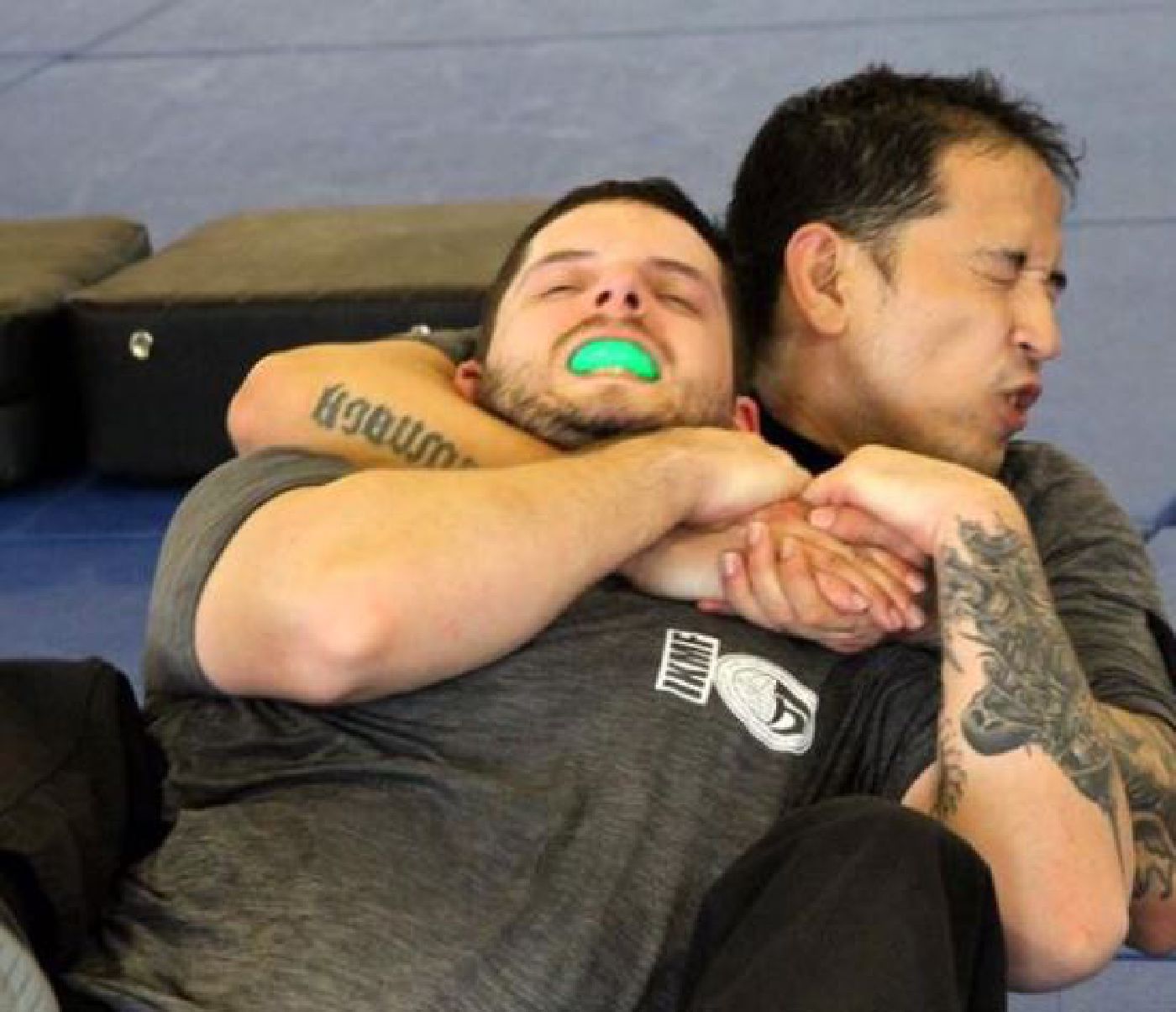 Krav Maga practitioners demonstrating a rear naked choke