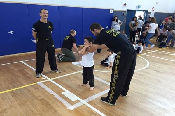 Krav Maga Kids learning how to defend against a choke