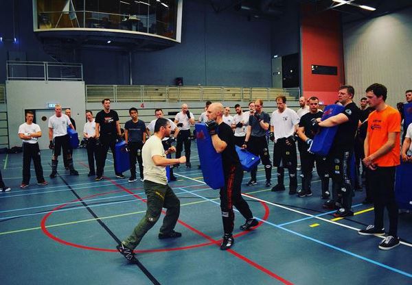 Krav Maga students preparing for padwork during a Krav Maga lesson